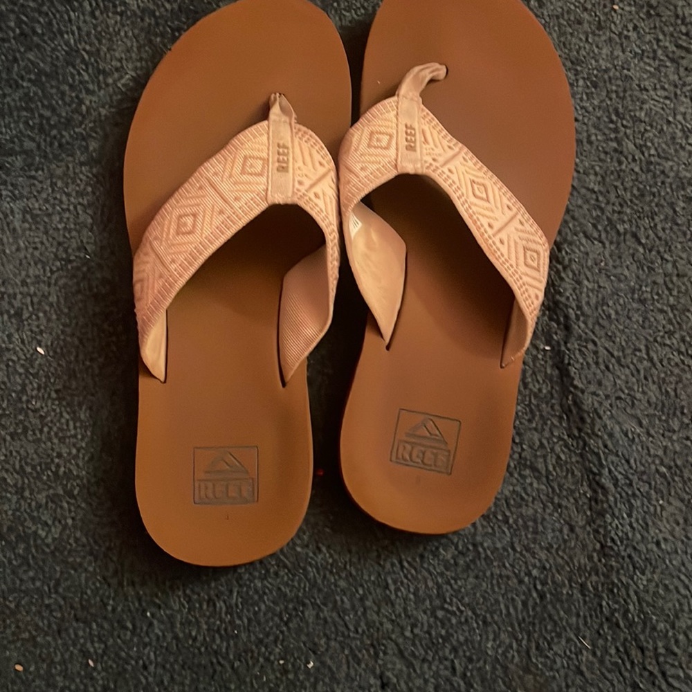 Reef sandals. could fit a variety of sizes. lightly worn. perfect for the beach!